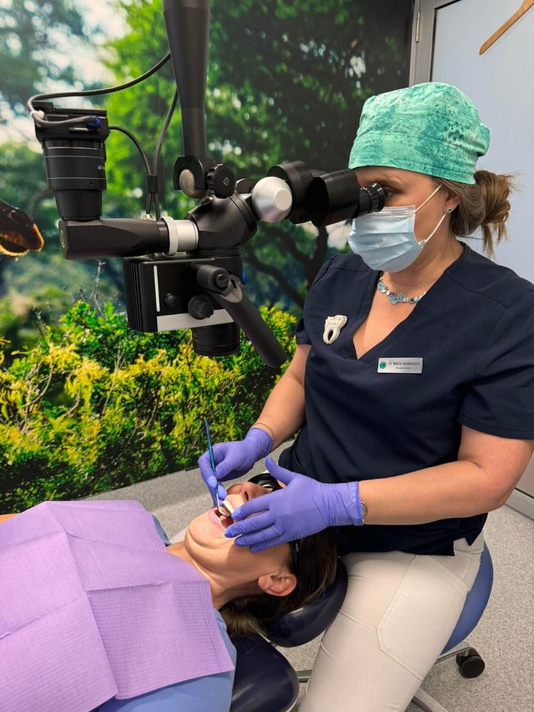 Dr Andersson using the dental microscope to access greater insight into the patient’s tooth.
